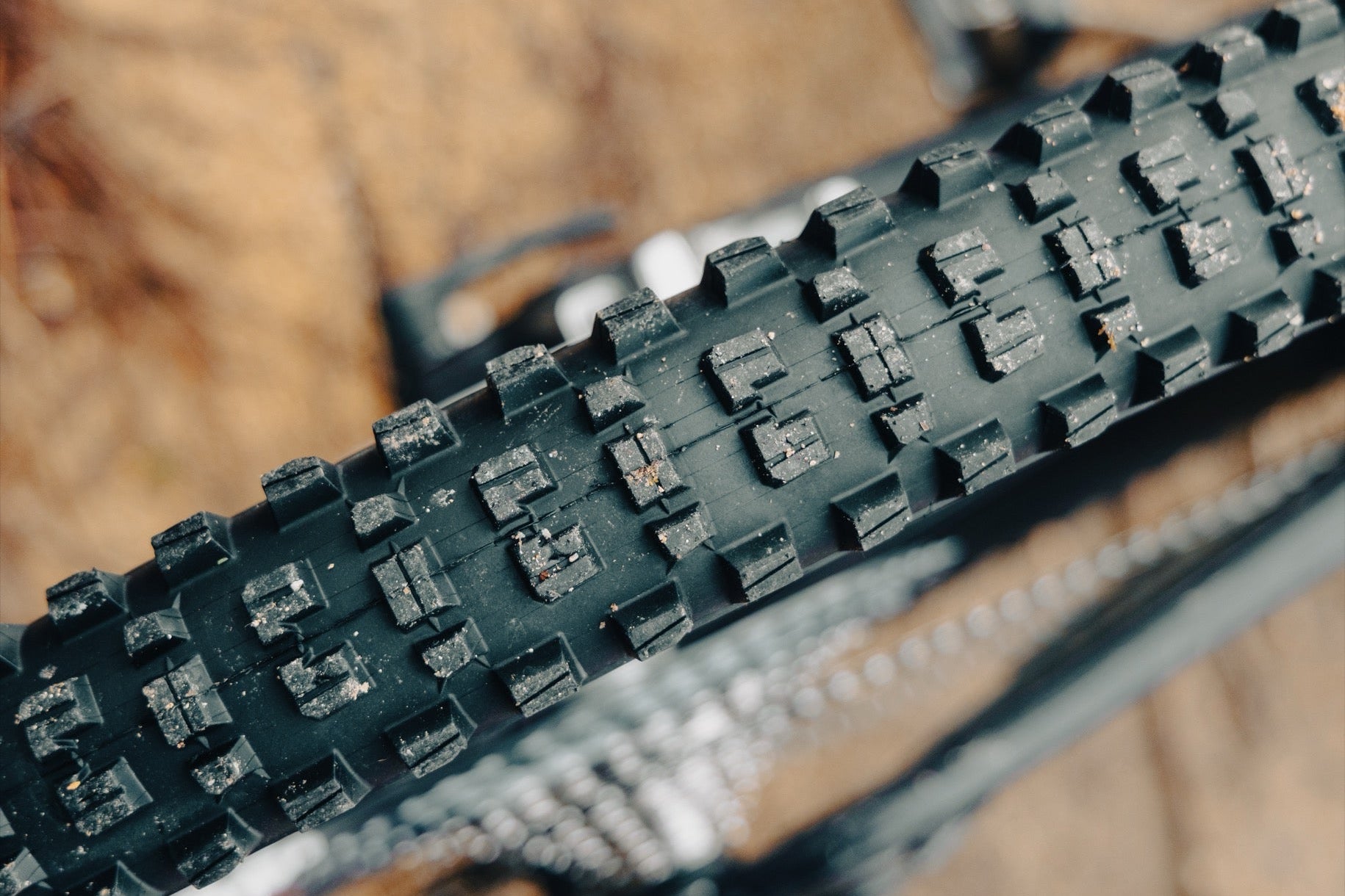 A Grappler tire tread packed with mud on the trail