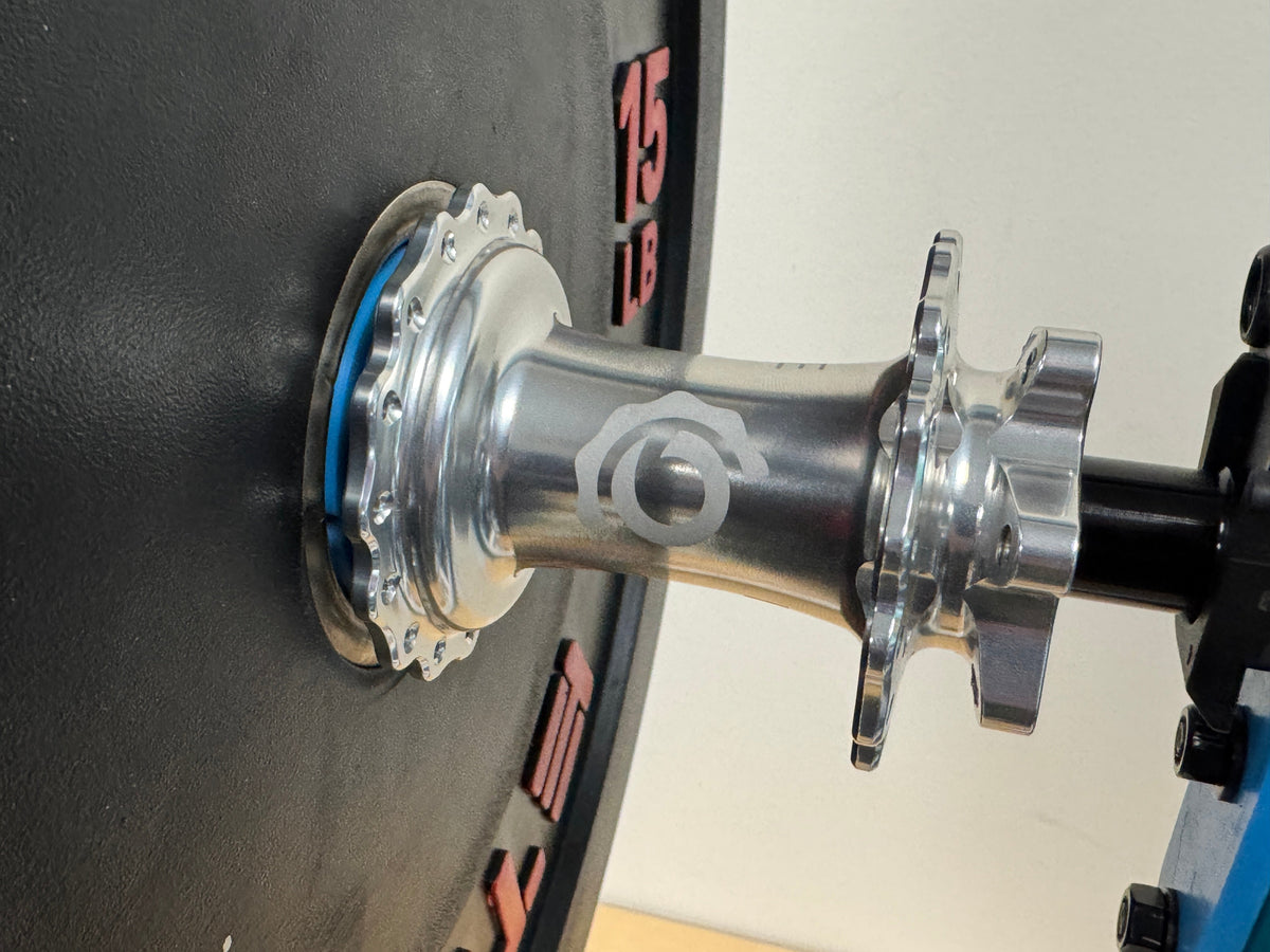 An Industry Nine Hydra hub mounted on the weighted plate for the spin-down test.